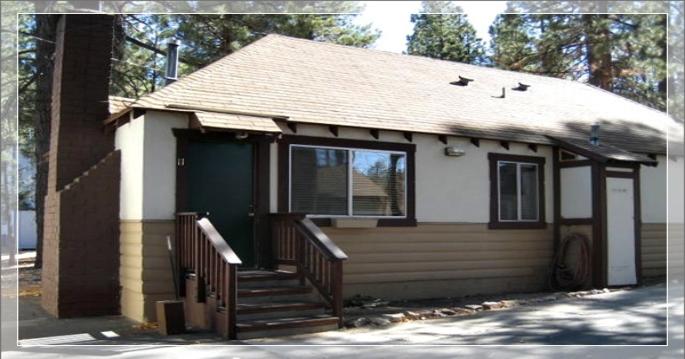 Cabins #10 and 11 with fireplace, 2 bedrooms, kitchens, small living room next to the volleyball court