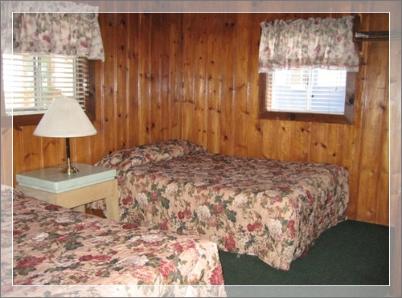 Bedroom #1 in cabin #7 two queen beds in each room